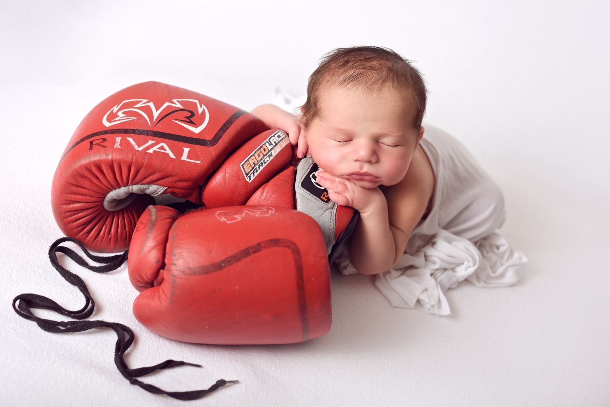 Baby and boxing gloves